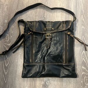 Brand new Black with brown trim, leather purse.